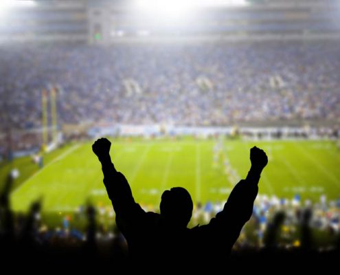 fan cheering at a football game