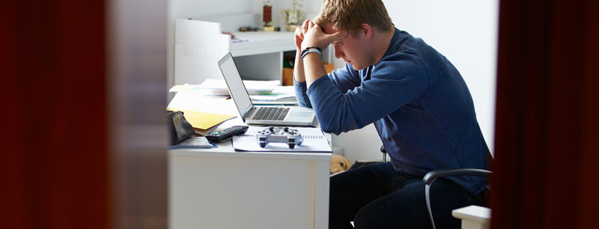 male student agonizing over his college application essays