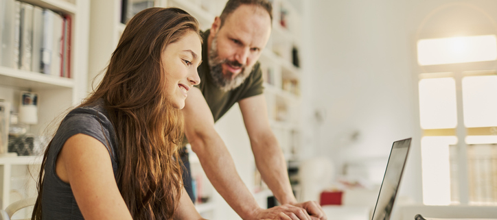 parent homeschooling his student during Covid-19