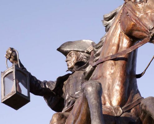 statue of Paul revere on his horse with a lantern