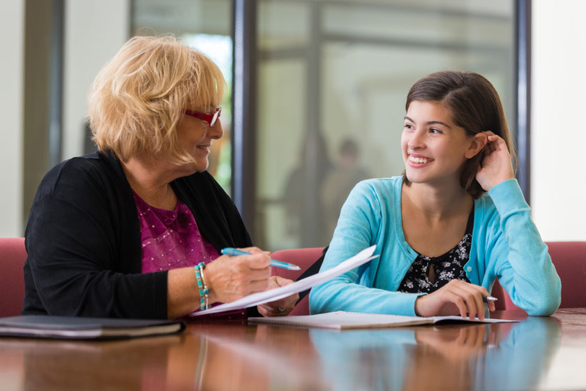 College Counselor   Student Working With A College Counsleor 