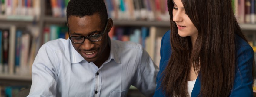 tutor helping a high school student with homework